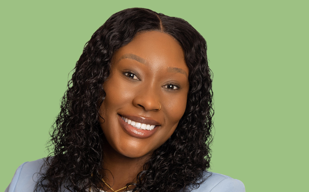 Headshot of a business woman on a green background
