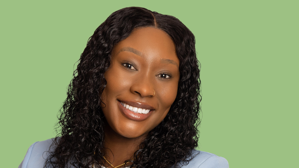 Headshot of a business woman on a green background